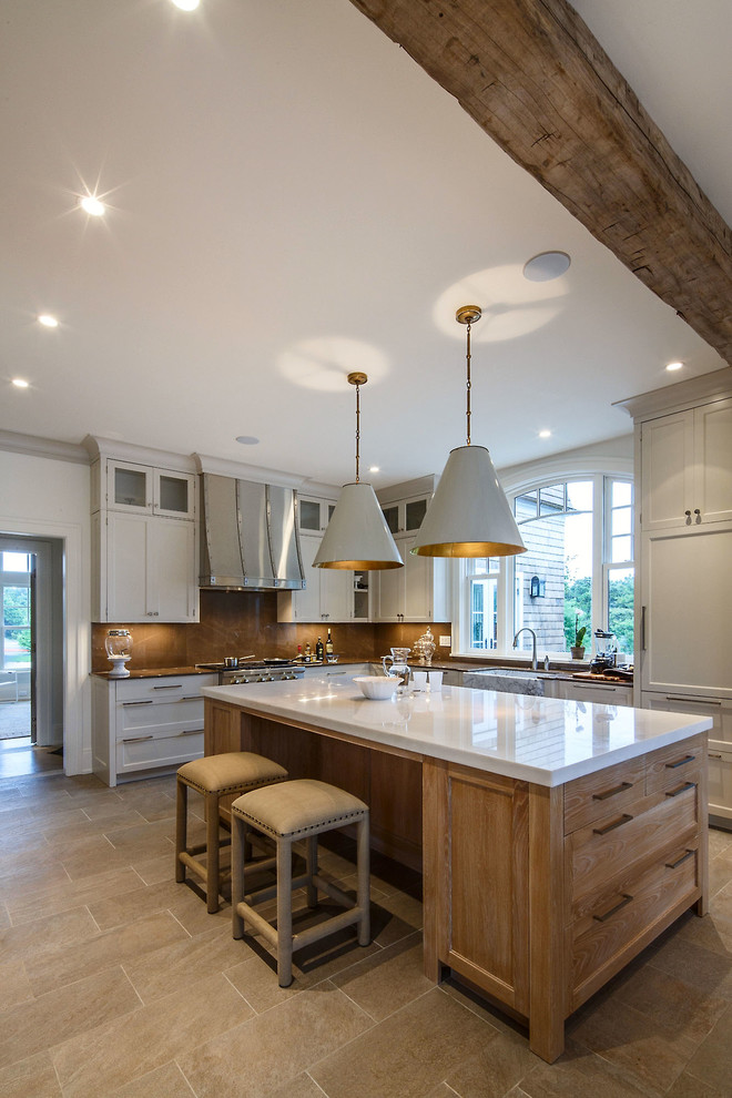 Inspiration for a transitional ceramic tile kitchen remodel in Boston with a farmhouse sink, shaker cabinets, white cabinets, quartz countertops, brown backsplash, stone slab backsplash, paneled appliances and an island