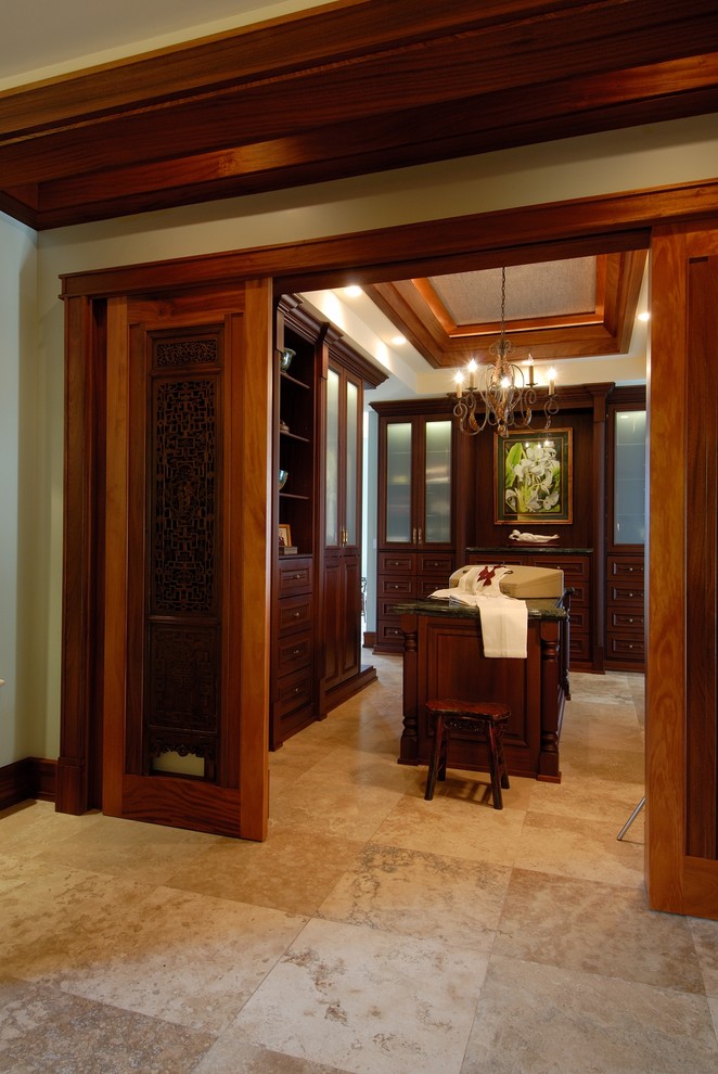 This is an example of a traditional dressing room in Hawaii with travertine floors.
