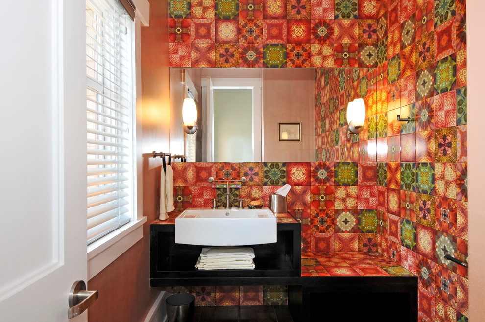 Design ideas for a small eclectic powder room in New York with open cabinets, black cabinets, green tile, multi-coloured tile, orange tile, pink tile, red tile, white tile, yellow tile, porcelain tile, red walls, an integrated sink and tile benchtops.