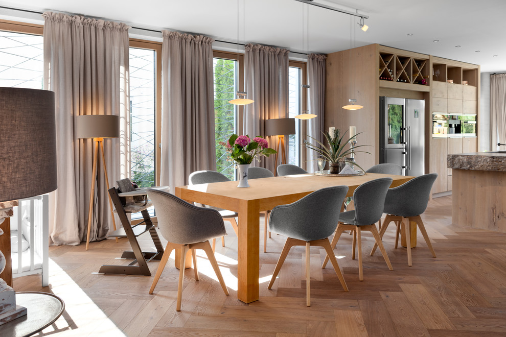 Inspiration for a large contemporary open plan dining in Stuttgart with medium hardwood floors, beige floor, white walls and no fireplace.