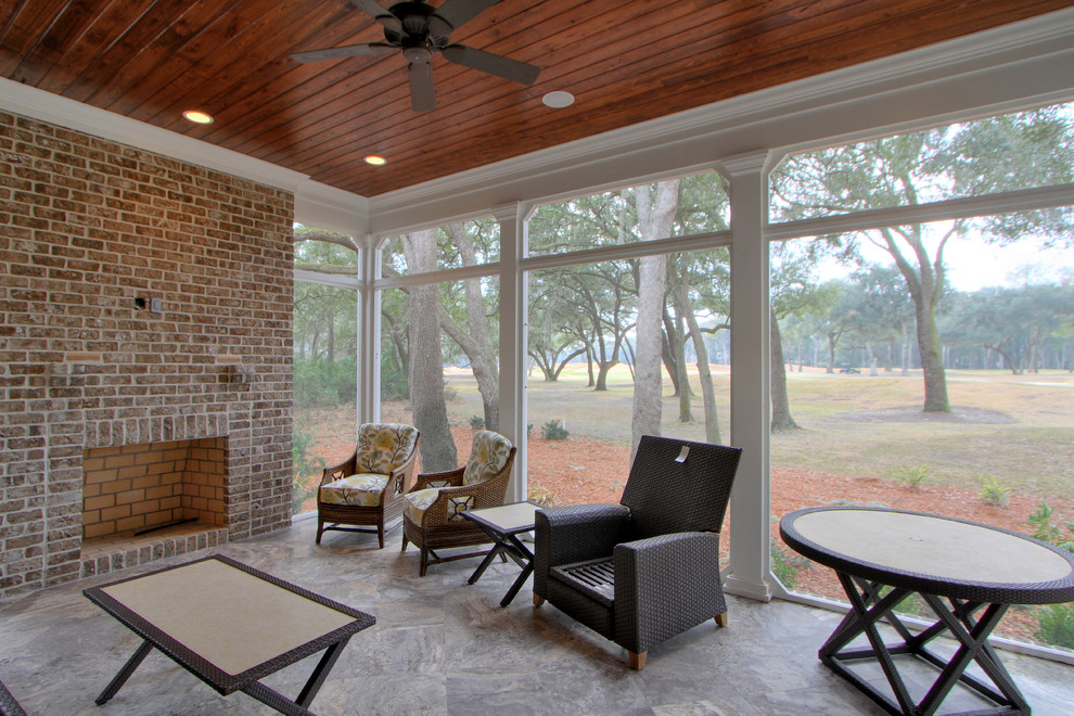 Large transitional sunroom in Atlanta with porcelain floors, a standard fireplace, a brick fireplace surround, a standard ceiling and grey floor.