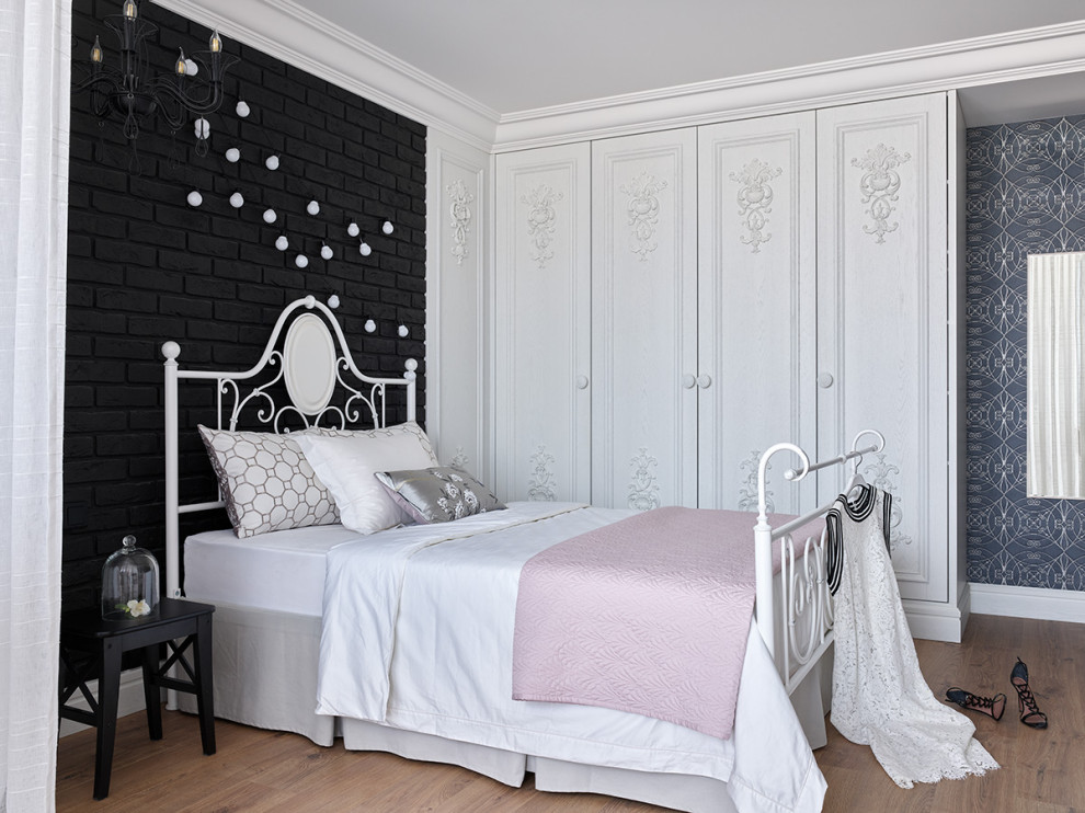 Design ideas for a mid-sized traditional kids' room for girls in Other with black walls, laminate floors, brown floor, recessed and brick walls.