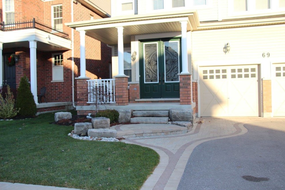 Photo of a large traditional front door in Toronto with concrete floors, a double front door and a green front door.