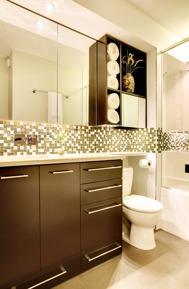 Inspiration for a contemporary bathroom in Seattle with flat-panel cabinets, dark wood cabinets, an alcove tub, a shower/bathtub combo, green tile and mosaic tile.