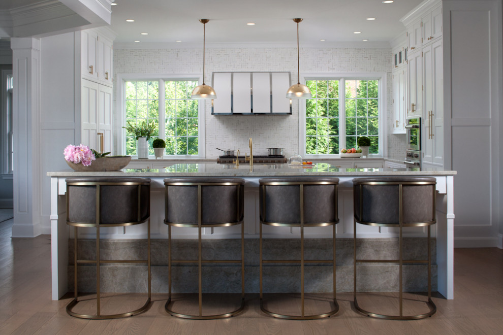 Example of a trendy dark wood floor and brown floor eat-in kitchen design in Baltimore with recessed-panel cabinets, white cabinets, soapstone countertops, stainless steel appliances, an island and gray countertops