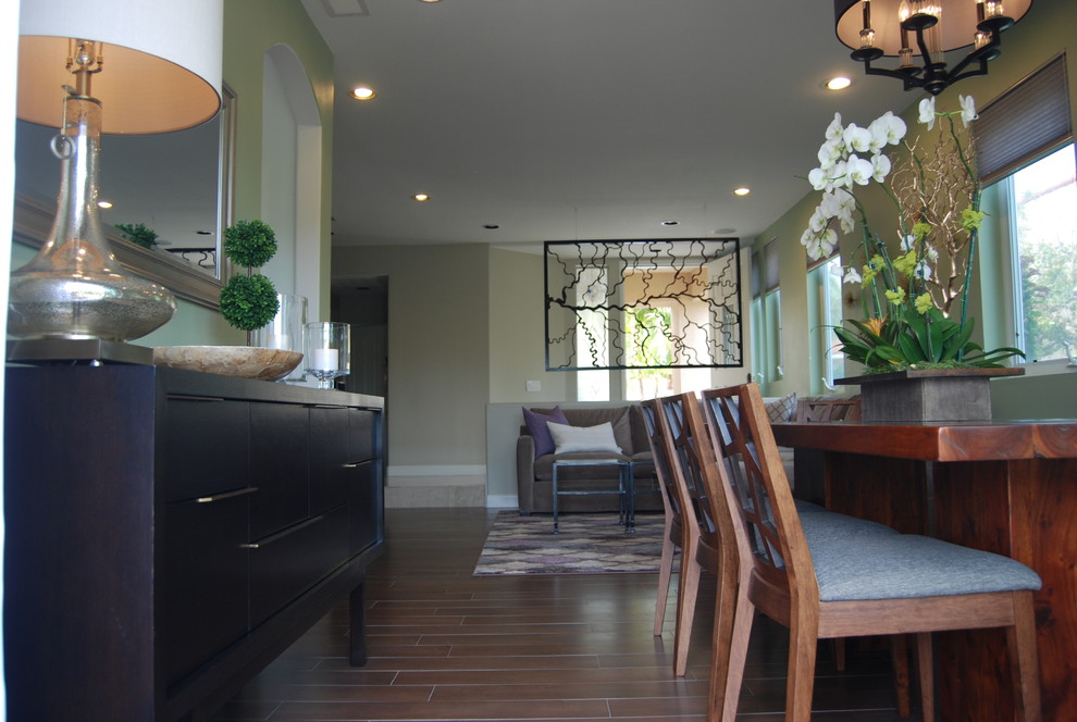Large transitional porcelain tile great room photo in Orange County with green walls