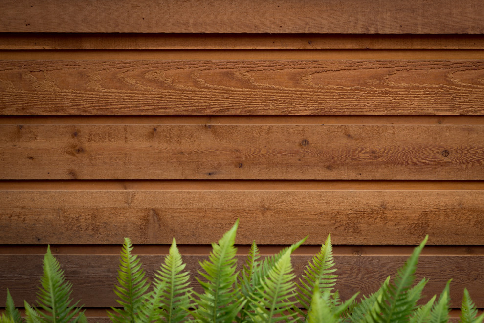 Inspiration for a townhouse exterior in Richmond with wood siding.