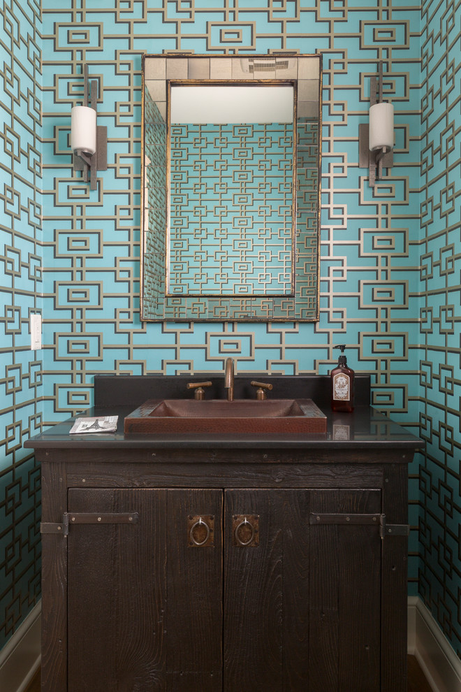 Small elegant powder room photo in Milwaukee with furniture-like cabinets, dark wood cabinets, multicolored walls, a drop-in sink and quartz countertops