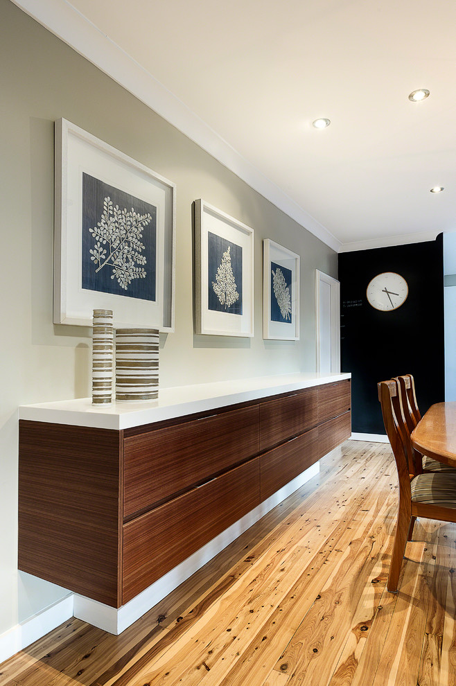 This is an example of a contemporary dining room in Sydney.