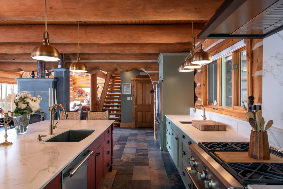 Example of a large mountain style galley slate floor and multicolored floor eat-in kitchen design in Ottawa with an undermount sink, recessed-panel cabinets, green cabinets, quartz countertops, white backsplash, quartz backsplash, stainless steel appliances, an island and white countertops
