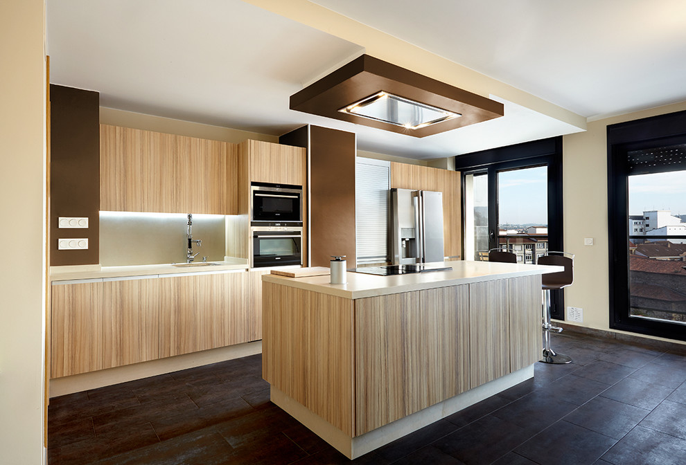 Photo of a large modern galley separate kitchen in Other with an undermount sink, flat-panel cabinets, medium wood cabinets, solid surface benchtops, beige splashback, stainless steel appliances and with island.