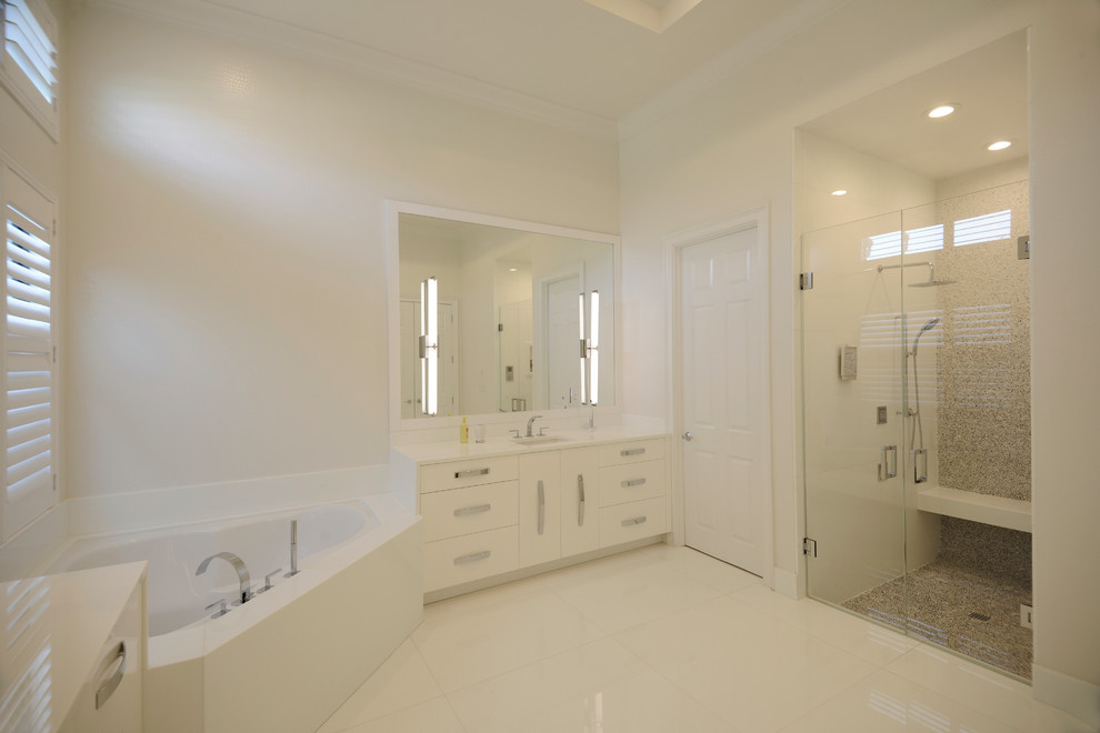 Design ideas for a large contemporary master bathroom in Miami with an undermount sink, flat-panel cabinets, white cabinets, glass benchtops, an undermount tub, an alcove shower, white walls, ceramic floors, gray tile, mosaic tile, white floor and a hinged shower door.