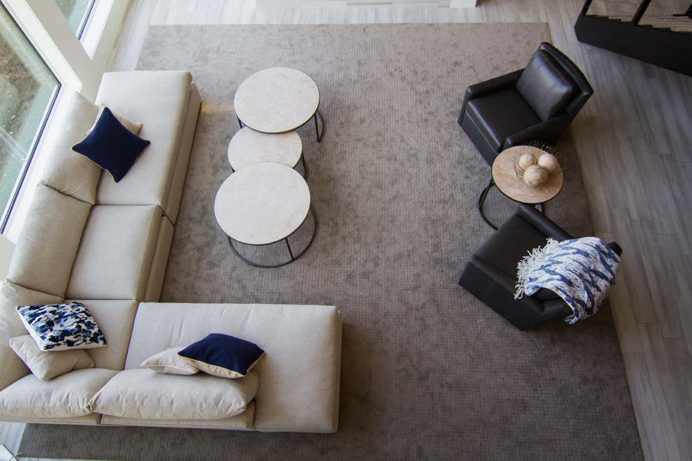 Basement - large transitional look-out basement idea with gray walls, a standard fireplace and a tile fireplace
