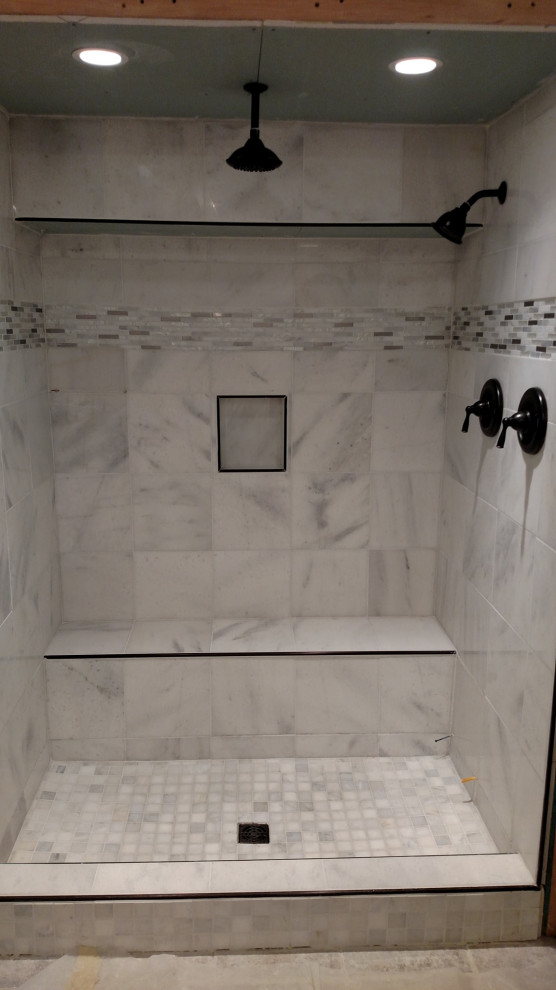 Example of a kids' bathroom design with glass-front cabinets and a floating vanity