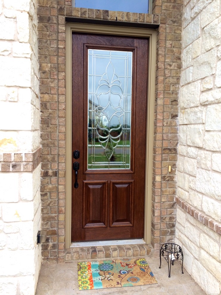 Photo of a mid-sized traditional front door in Austin with red walls, brick floors, a single front door, a white front door and red floor.