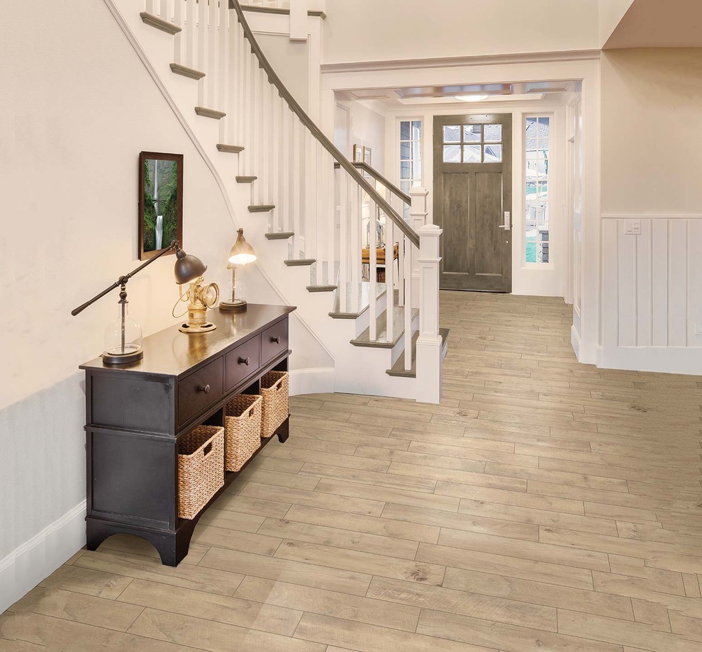 Design ideas for a mid-sized contemporary foyer in Raleigh with porcelain floors, beige walls, a single front door and a dark wood front door.