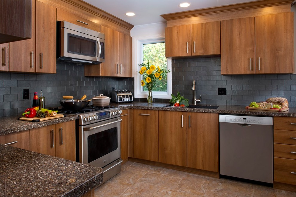 This is an example of a large transitional u-shaped kitchen pantry in Jacksonville with an undermount sink, flat-panel cabinets, medium wood cabinets, granite benchtops, grey splashback, subway tile splashback, stainless steel appliances, ceramic floors, no island, brown floor, multi-coloured benchtop and recessed.