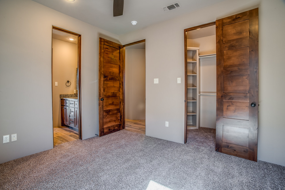 Mid-sized transitional master bedroom in Austin with beige walls, carpet and no fireplace.