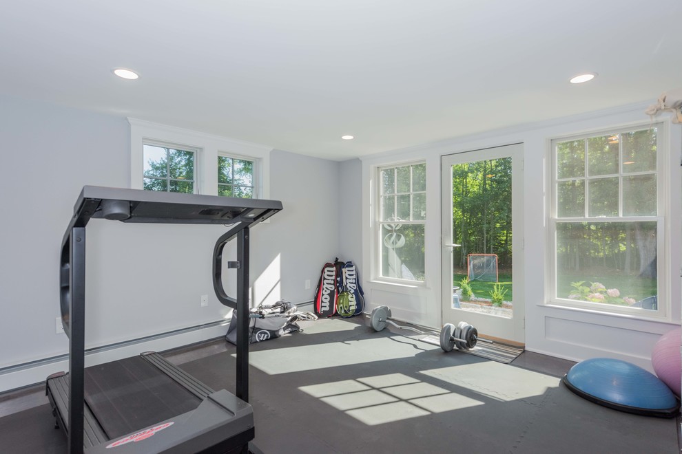 Photo of a small transitional multipurpose gym in Bridgeport with grey walls and grey floor.