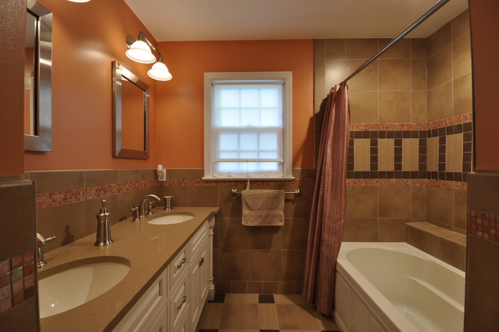 Example of a mid-sized transitional kids' brown tile and porcelain tile porcelain tile alcove bathtub design in DC Metro with furniture-like cabinets, white cabinets, orange walls, quartz countertops and an undermount sink