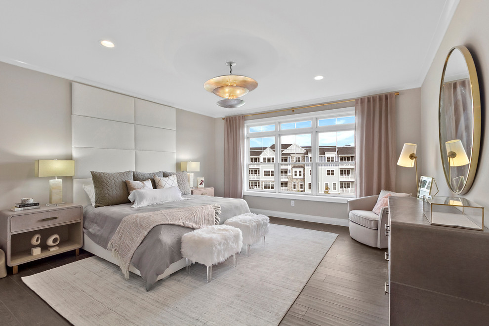 Design ideas for a transitional bedroom in New York with beige walls, dark hardwood floors and brown floor.