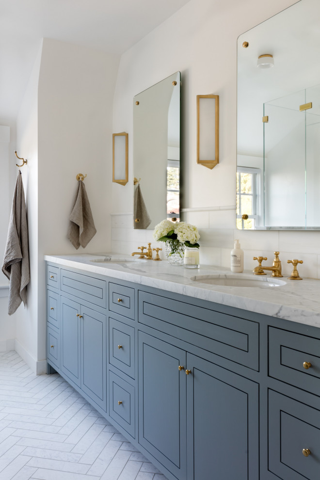 Example of a transitional white floor and double-sink bathroom design in Seattle with flat-panel cabinets, blue cabinets, white walls, an undermount sink and white countertops