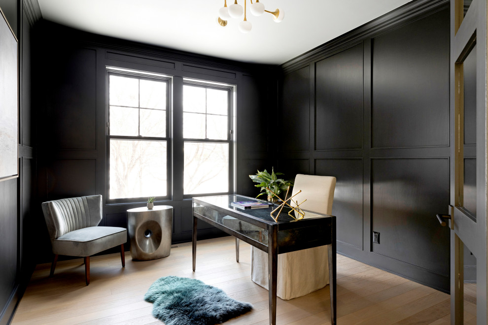Inspiration for a scandinavian home office in Minneapolis with black walls and light hardwood floors.