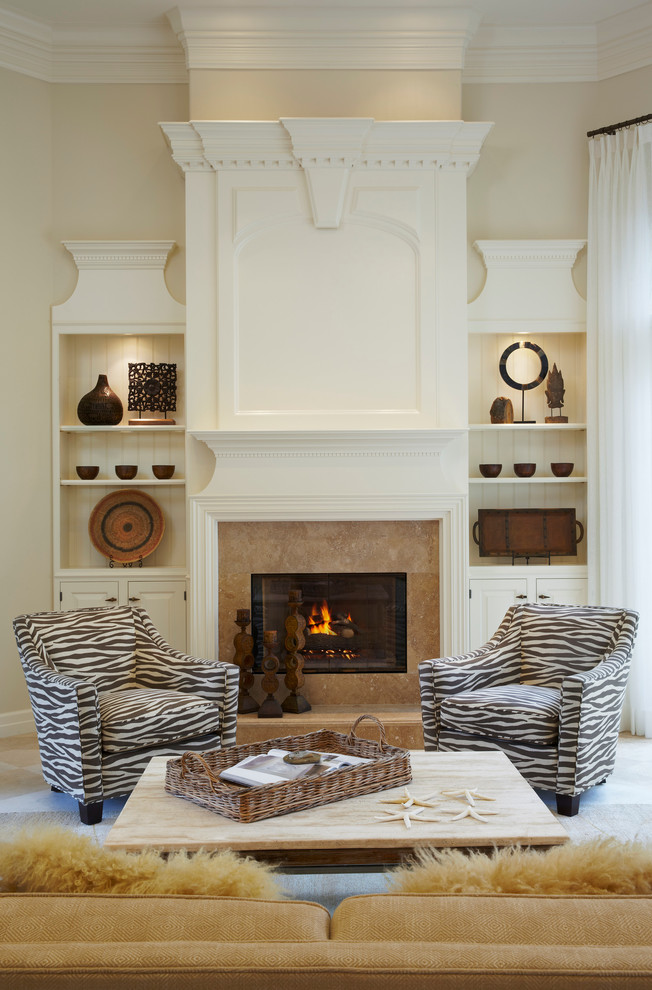 Inspiration for a transitional living room in Miami with beige walls and a standard fireplace.