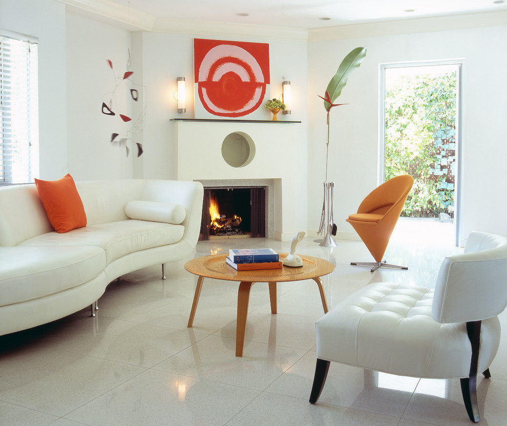 This is an example of a small modern open concept living room in New York with white walls, ceramic floors, a standard fireplace and a plaster fireplace surround.