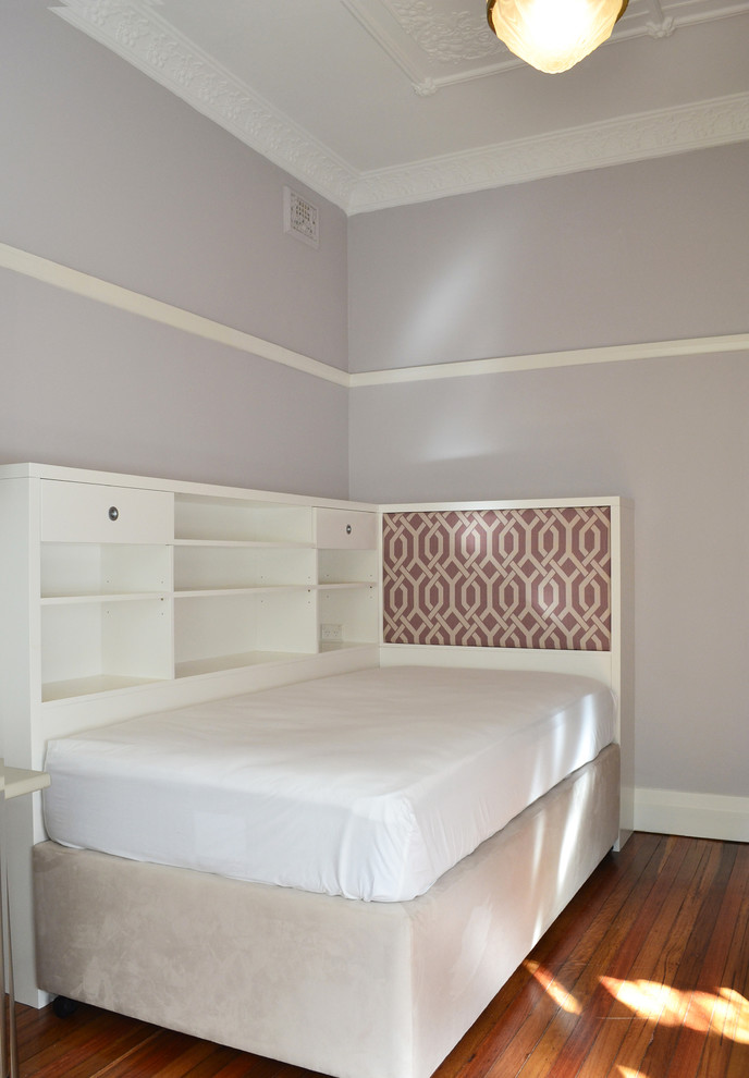 Design ideas for a mid-sized contemporary kids' bedroom for kids 4-10 years old and girls in Sydney with purple walls, medium hardwood floors and brown floor.