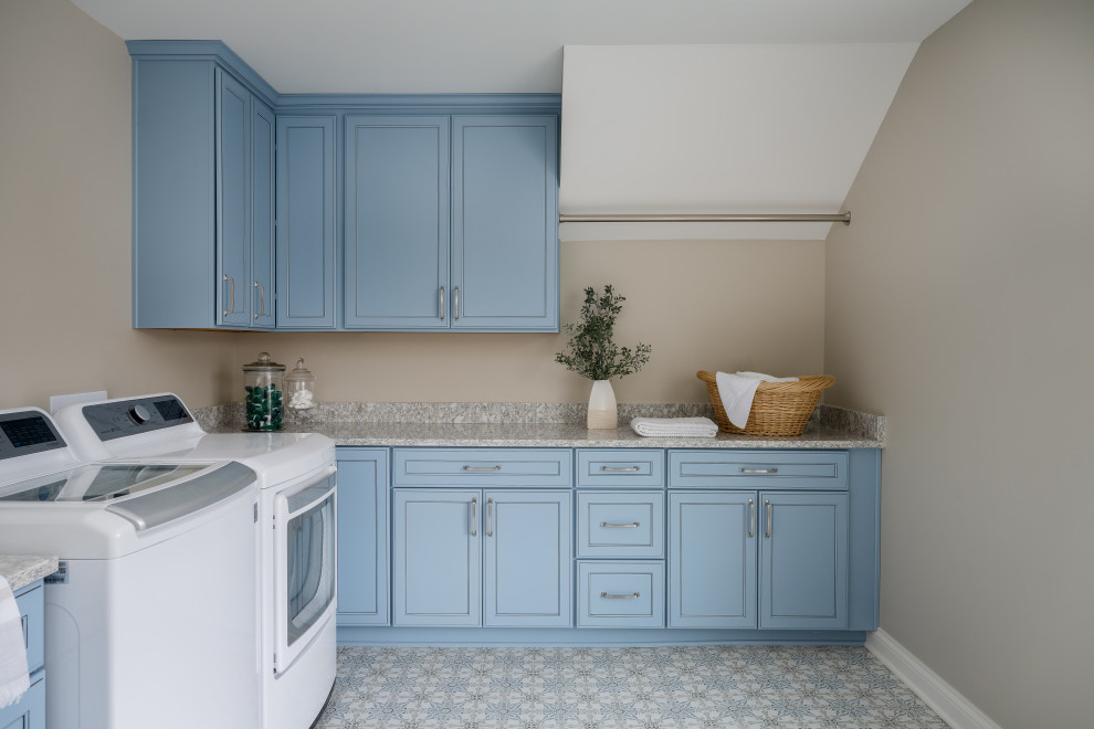 Design ideas for a medium sized modern galley separated utility room in Indianapolis with a submerged sink, blue cabinets, granite worktops, beige walls, ceramic flooring and a side by side washer and dryer.