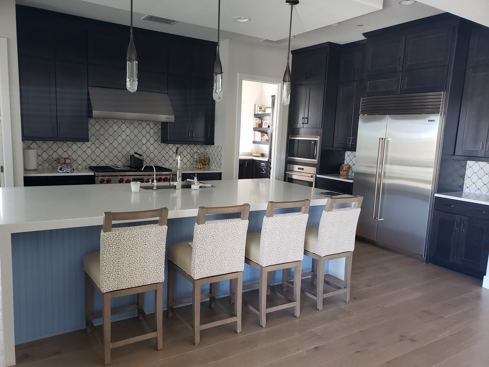 Huge transitional porcelain tile eat-in kitchen photo in Phoenix with an undermount sink, shaker cabinets, dark wood cabinets, quartz countertops, multicolored backsplash, stainless steel appliances, an island and white countertops