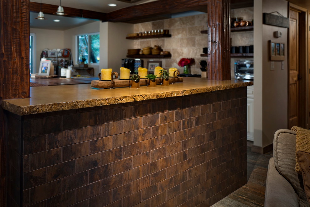 Eat-in kitchen - mid-sized rustic single-wall porcelain tile eat-in kitchen idea in Phoenix with a farmhouse sink, raised-panel cabinets, white cabinets, concrete countertops, beige backsplash, metal backsplash, stainless steel appliances and two islands