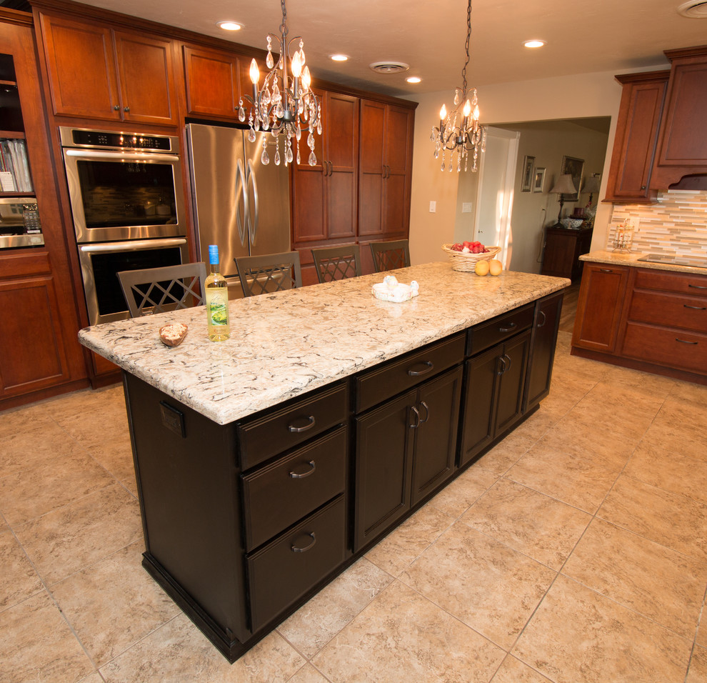 Kitchen - large transitional u-shaped porcelain tile kitchen idea with an undermount sink, flat-panel cabinets, medium tone wood cabinets, quartz countertops, beige backsplash, mosaic tile backsplash, stainless steel appliances and an island