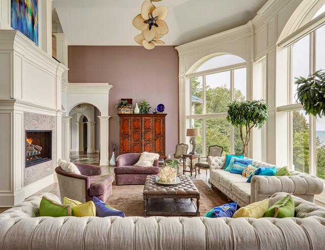 Two Story Living Room With Arched Floor To Ceiling Windows