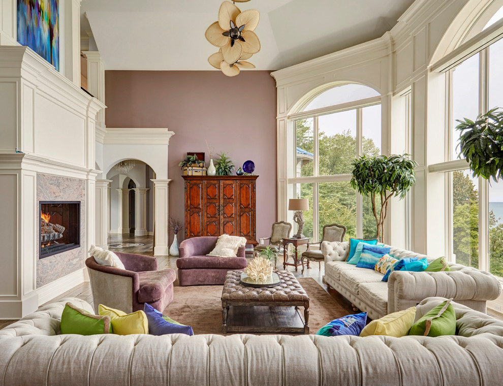 Inspiration for an expansive traditional formal enclosed living room in Chicago with purple walls, dark hardwood floors, a standard fireplace, a stone fireplace surround, no tv and brown floor.