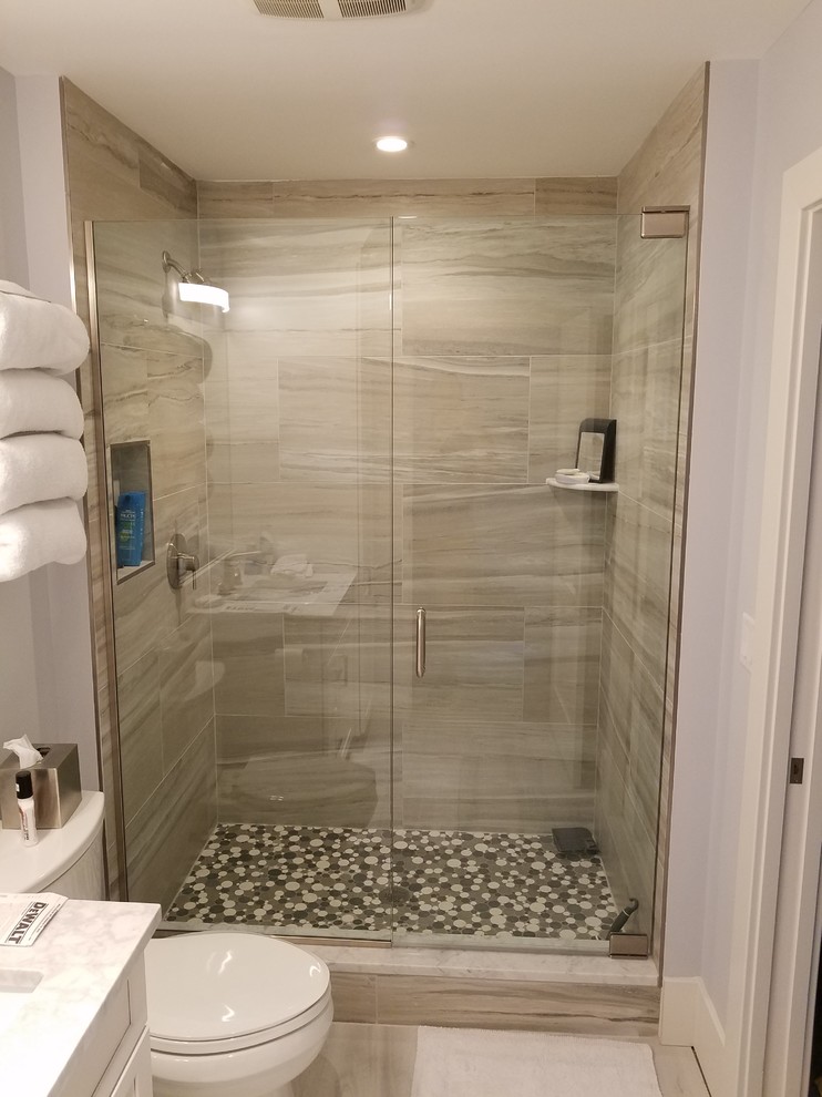 Contemporary bathroom in Miami with an alcove shower and a hinged shower door.