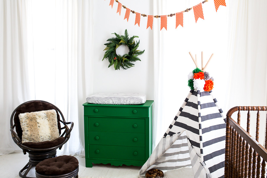 Design ideas for a mid-sized eclectic gender-neutral nursery in Atlanta with white walls and painted wood floors.