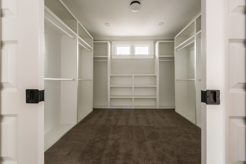 Inspiration for a large arts and crafts storage and wardrobe in Atlanta with dark hardwood floors and brown floor.