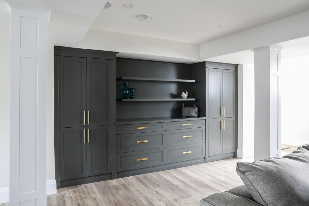Basement - large transitional look-out vinyl floor and brown floor basement idea with white walls