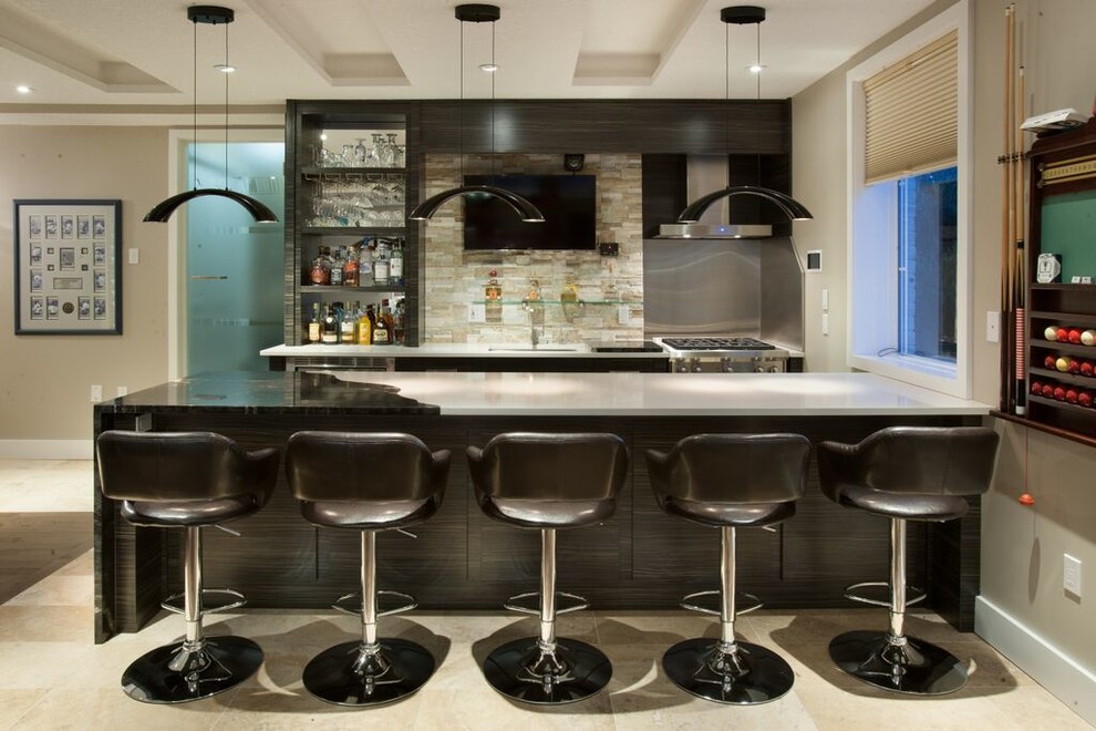 Inspiration for a large transitional seated home bar in Toronto with dark wood cabinets, solid surface benchtops, stone tile splashback and an undermount sink.