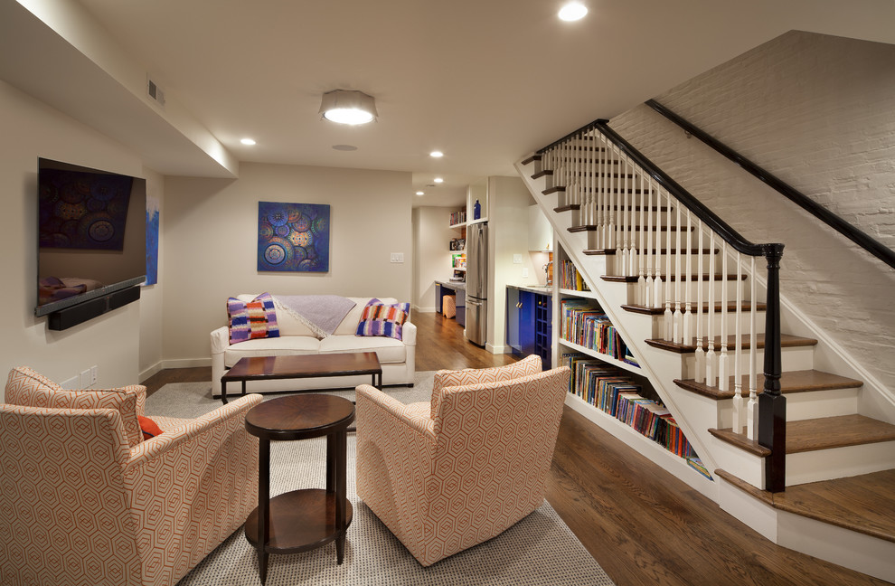 This is an example of a mid-sized eclectic fully buried basement in DC Metro with grey walls, no fireplace and dark hardwood floors.