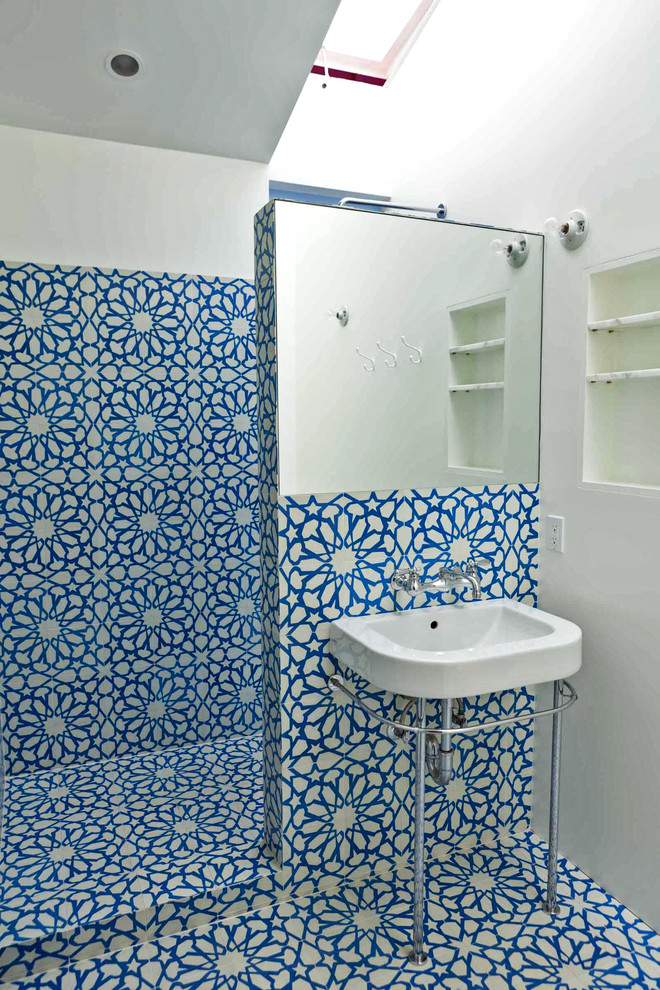 This is an example of an eclectic bathroom in Los Angeles with cement tile.