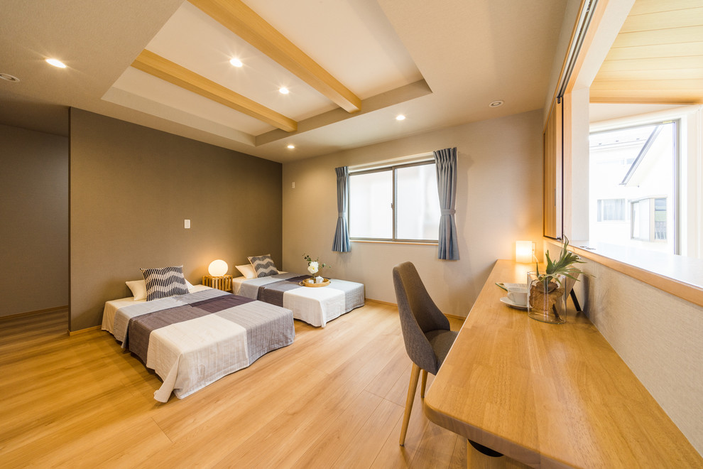 This is an example of a large asian bedroom in Other with white walls, light hardwood floors and brown floor.
