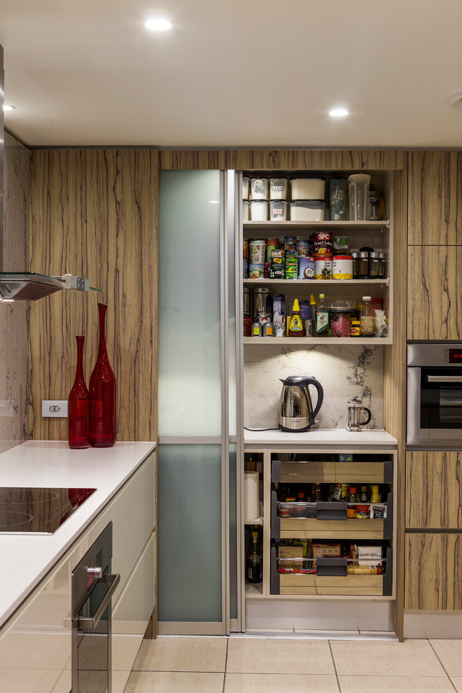 Design ideas for a mid-sized modern l-shaped kitchen pantry in Brisbane with a double-bowl sink, flat-panel cabinets, beige cabinets, quartz benchtops, white splashback, marble splashback, stainless steel appliances, porcelain floors, with island and beige floor.