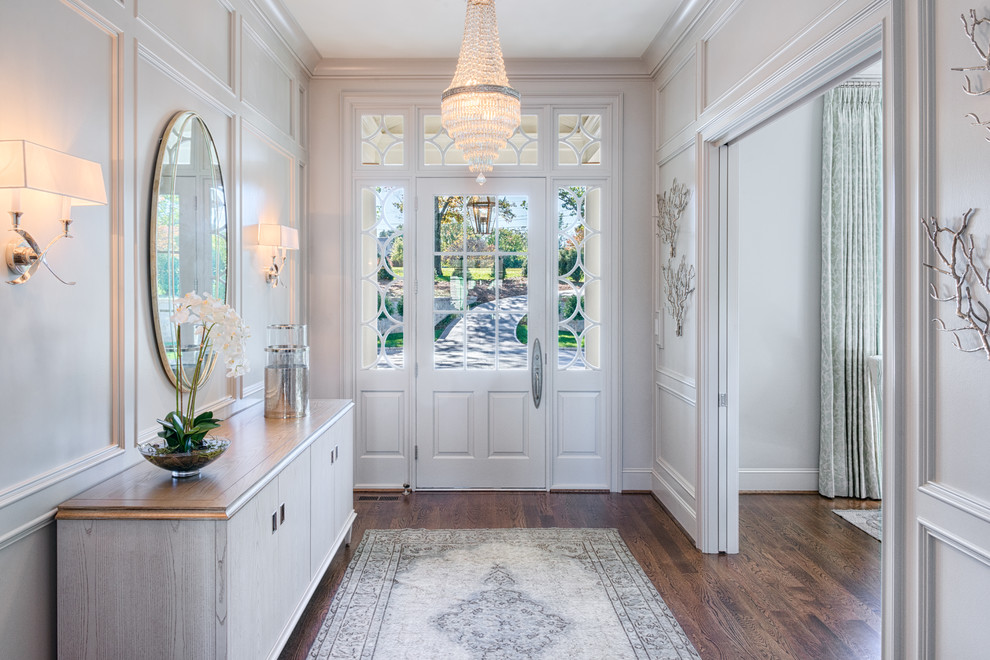 Inspiration for a large transitional dark wood floor single front door remodel with gray walls