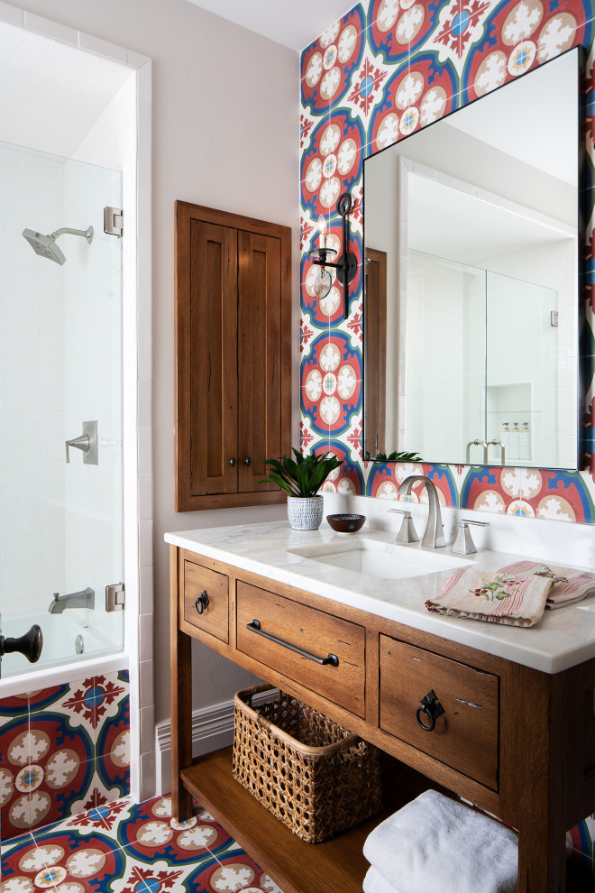 Mediterranean bathroom in Austin with medium wood cabinets, white walls, quartz worktops, a single sink, a freestanding vanity unit, cement tiles, cement flooring, multi-coloured tiles and multi-coloured floors.