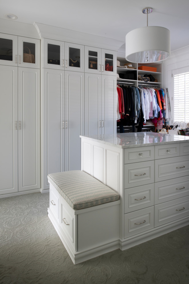 Large beach style gender-neutral carpeted and green floor walk-in closet photo in Minneapolis with raised-panel cabinets and white cabinets