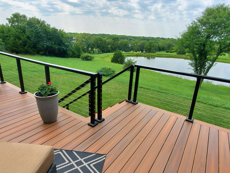 Design ideas for a large contemporary back first floor metal railing terrace in Kansas City.