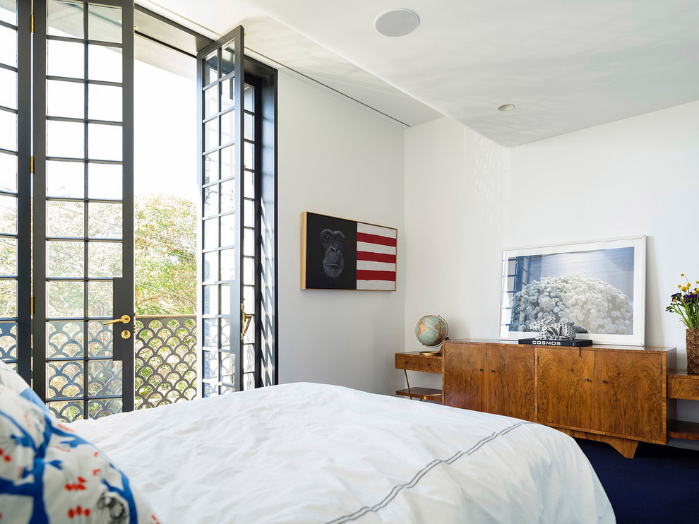 Transitional bedroom in Sydney with white walls and blue floor.